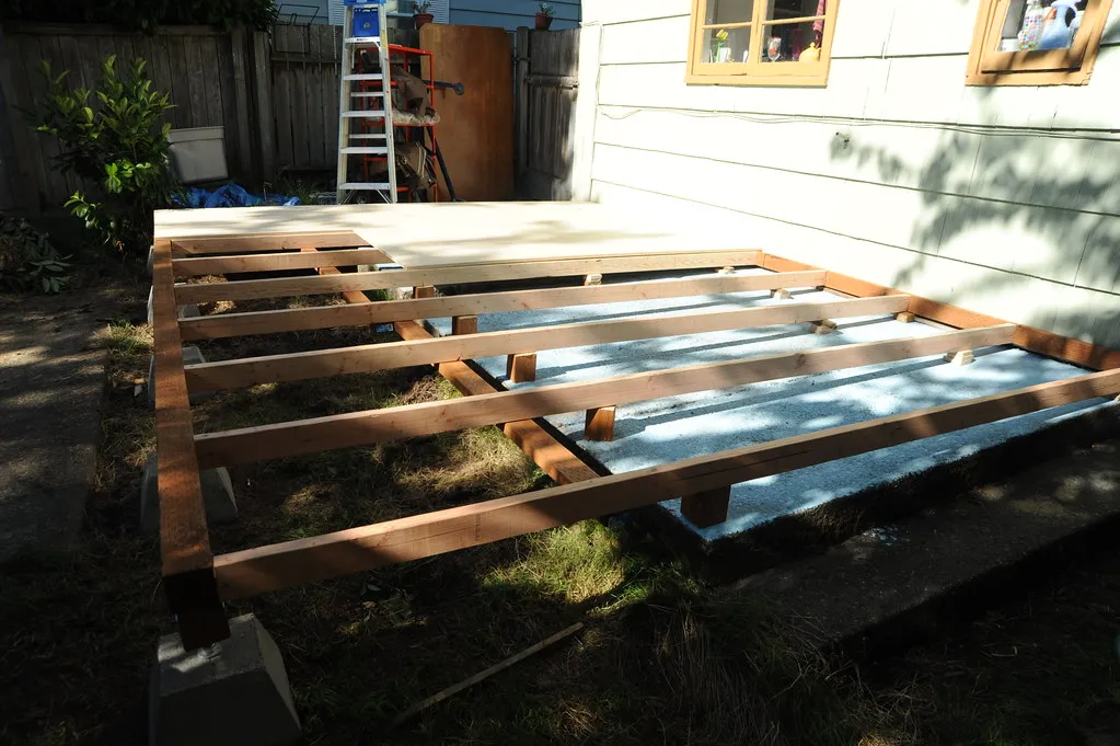Pressure-treated deck framing on concrete piers